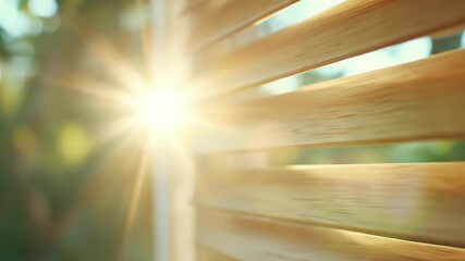 Sunlight streaming through wooden window blinds with bright lens flare warm light effect