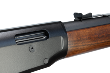 Rear sight and ejection port on a wood stocked lever action rifle
