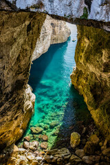 Gaeta, Latina, Lazio, Italy. A splendid view of the city. The ancient village with its houses overlooking the sea. The spectacular Grotta del Turco on the Montagna Spaccata (Split Mountain) cliff.