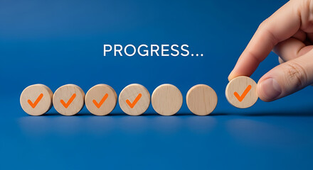 Hand placing wooden circle with a checkmark on a line of other circles, signifying progress.