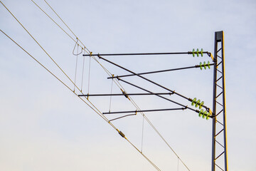 Railway Overhead Catenary System: High Voltage Power Lines and Insulators on a Metal Mast