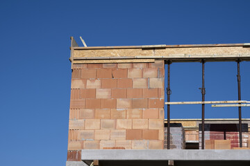 Construction workers assembling formwork for a new structural element