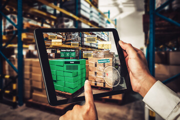 Smart warehouse management system using augmented reality technology to identify package picking and delivery . Future concept of supply chain and logistic business .