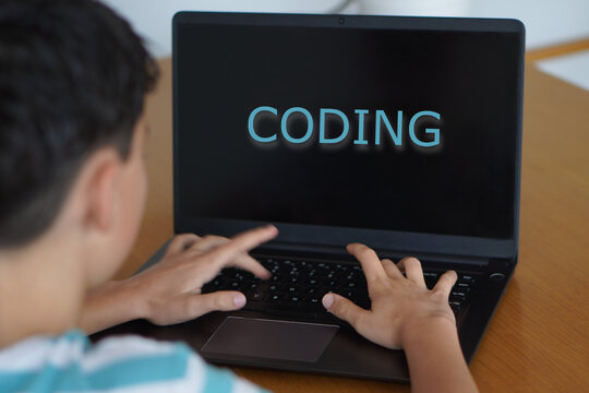 coding. technology and teenagers. child with the word on his laptop screen - Powered by Adobe