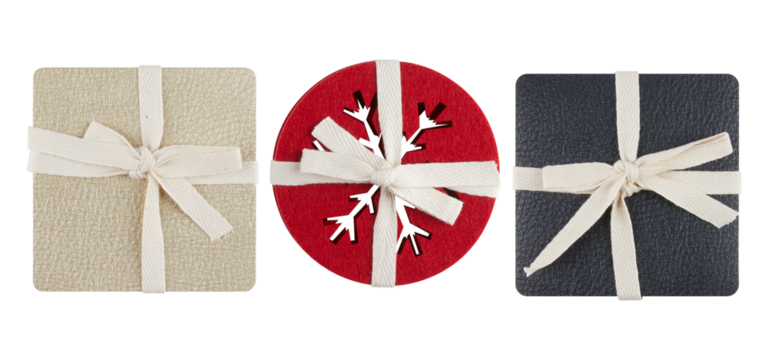 Bright red round coaster with a snowflake pattern cut out in the center cut out isolated transparent background