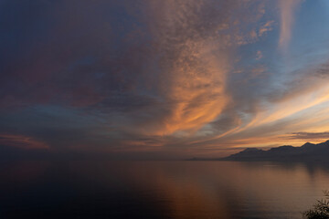 Sunset Over Mountains and Calm Sea