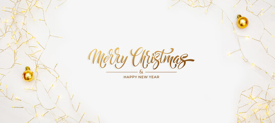 Merry Christmas and Happy New Year greeting card, frame, and banner. Holidays design. Noel and Feliz Navidad. Christmas gifts and decorations, top view. Flat lay.