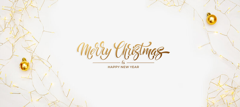 Merry Christmas and Happy New Year greeting card, frame, and banner. Holidays design. Noel and Feliz Navidad. Christmas gifts and decorations, top view. Flat lay.