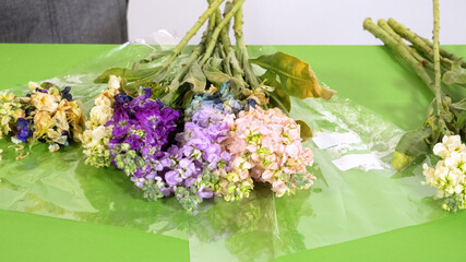 Group of mixed flowers placed for wrapping