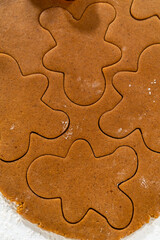 Preparing and Baking Classic Gingerbread Cookies in Gingerbread Man Shapes