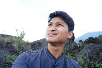 Natural Light Portrait of an Asian Man Looking Upward Outdoors