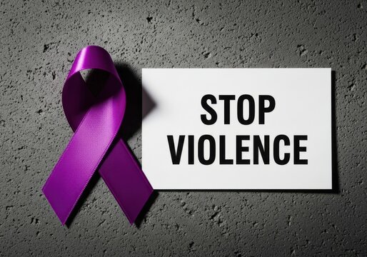Stop violence message on a card next to a purple ribbon, representing a strong stance against abuse and advocating for peace