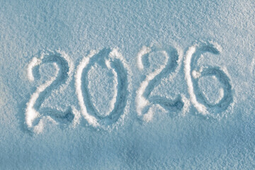 Inscription 2026 on real white snow as symbol of coming Christmas and New Year