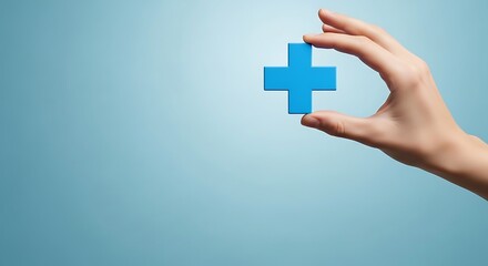 Obraz premium Hand holding a blue plus sign against a light blue gradient background