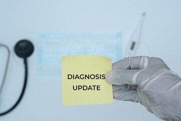 Diagnosis Update Note Held by Gloved Hand with Medical Instruments in Background .Healthcare and Clinical Review Concept