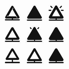 Set of nine triangular warning sign icons in black and white