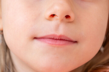 Close-up portrait five year old preschool girl with gentle smile, emotional intelligence, innocent and heartwarming smile, development and empathy skills, Social-emotional learning