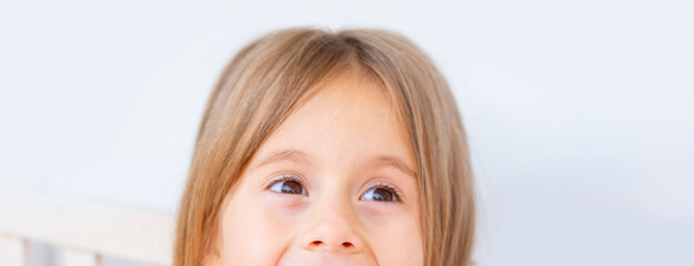 Happy little girl, joyful expression, Mischievous brown eyes, Bright childhood moment, casual clothes, playful childhood moment, cheerful outdoor portrait