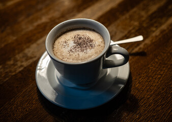 cup of coffee  on a wooden table