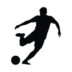 Silhouette of a soccer player kicking a ball in mid action