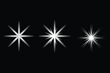 Three glowing starbursts on black background sparkle