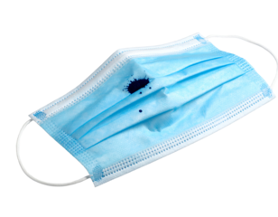 Used blue medical face mask with dark ink stains and elastic earloops on isolated background