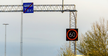 Variable Speed Limit Road Sign Displaying 60 kph on a Motorway Gantry Infrastructure