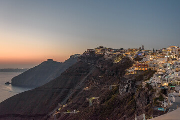 Sunset over the cliffside town of Fira, Santorini, Greece