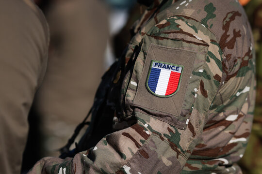 French soldier in combat gear during a military exercise.