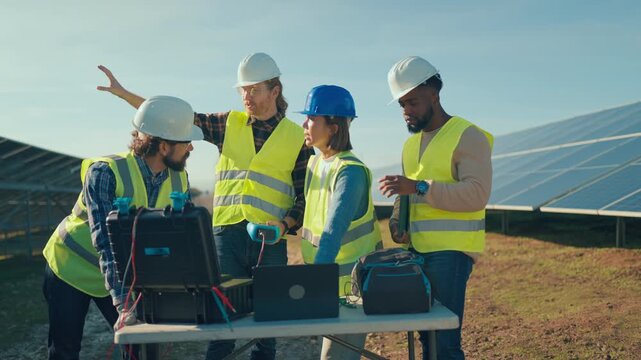 Team collaborates on solar energy project at a sunny outdoor site