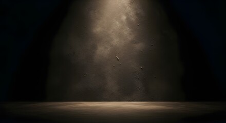 Dramatic spotlight illuminates textured wall and floor in darkness
