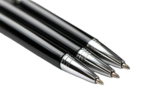 Close-up of three black ballpoint pens, angled, showing metal tips