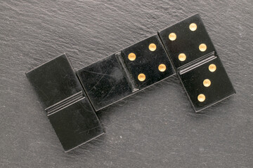 Old dice for playing dominoes, top view, macro.