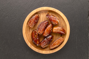 Dried sweet dates, top view, macro.