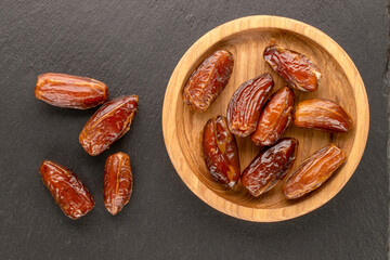 Dried sweet dates, top view, macro.