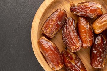 Dried sweet dates, top view, macro.