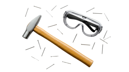 Overhead view of a metal hammer and protective safety goggles scattered with small metal nails on a dark transparent background