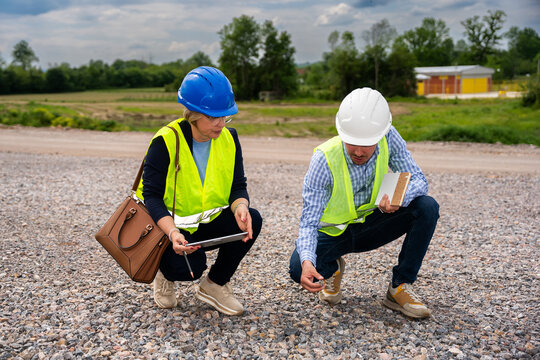 Highway engineers discuss and plan.