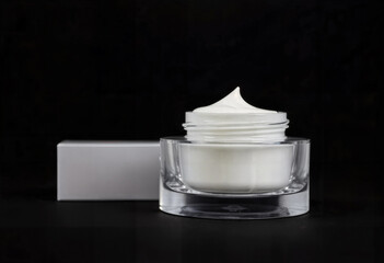 Cosmetic Face Cream Jar with Box on Black Background