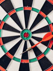 Precision Targeting with Dart on Classic Dartboard Game Surface
