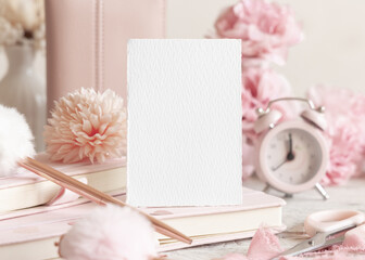 Vertical blank card near romantic pink decor, hearts and flowers closeup, Valentines spring mockup