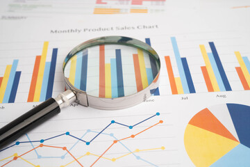 Magnifying glass on charts graphs paper. Financial development, Banking Account, Statistic, Investment Analytic research data economy.