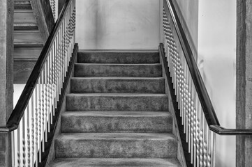 Black and White View of an Antique Wooden Staircase.
