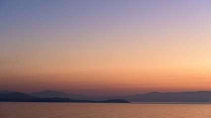 Serene landscape view of a sunset over calm waters