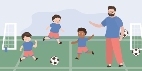 Happy boys playing ball, football school, coach and students. Multiethnic preschool boys play football. Childhood active leisure, entertainment and playtime.