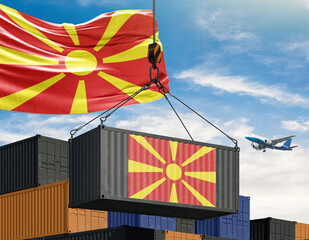 Macedonian Trade: Macedonian flag on a shipping container being lifted by a crane, symbolizing international trade and the movement of goods, against a backdrop of a clear sky and the plane.