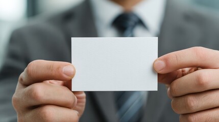 Fototapeta premium Detailed portrait of a man in engineering with an empty business card