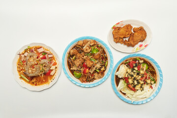 Green papaya salad Thai cuisine spicy delicious. Thai call "SOM TAM". Famous Thai food, papaya salad, Somtum, Papaya Pok Pok. Closeup Thai Green Papaya Salad with peanuts.