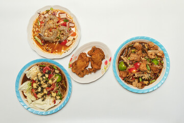 Green papaya salad Thai cuisine spicy delicious. Thai call "SOM TAM". Famous Thai food, papaya salad, Somtum, Papaya Pok Pok. Closeup Thai Green Papaya Salad with peanuts.