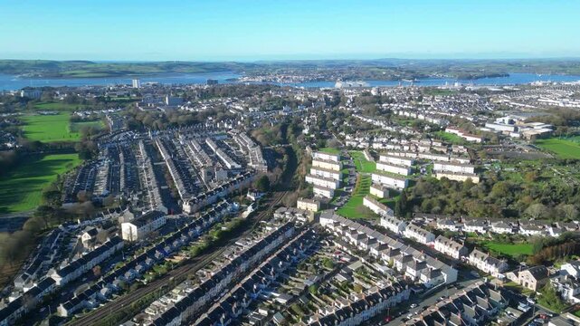 Plymouth, Devon, England: DRONE VIEWS: The drone shows the houses of Stoke Village in the foreground and the River Tamar and Devonport Docks in the distance. Plymouth is a historic naval port (2).